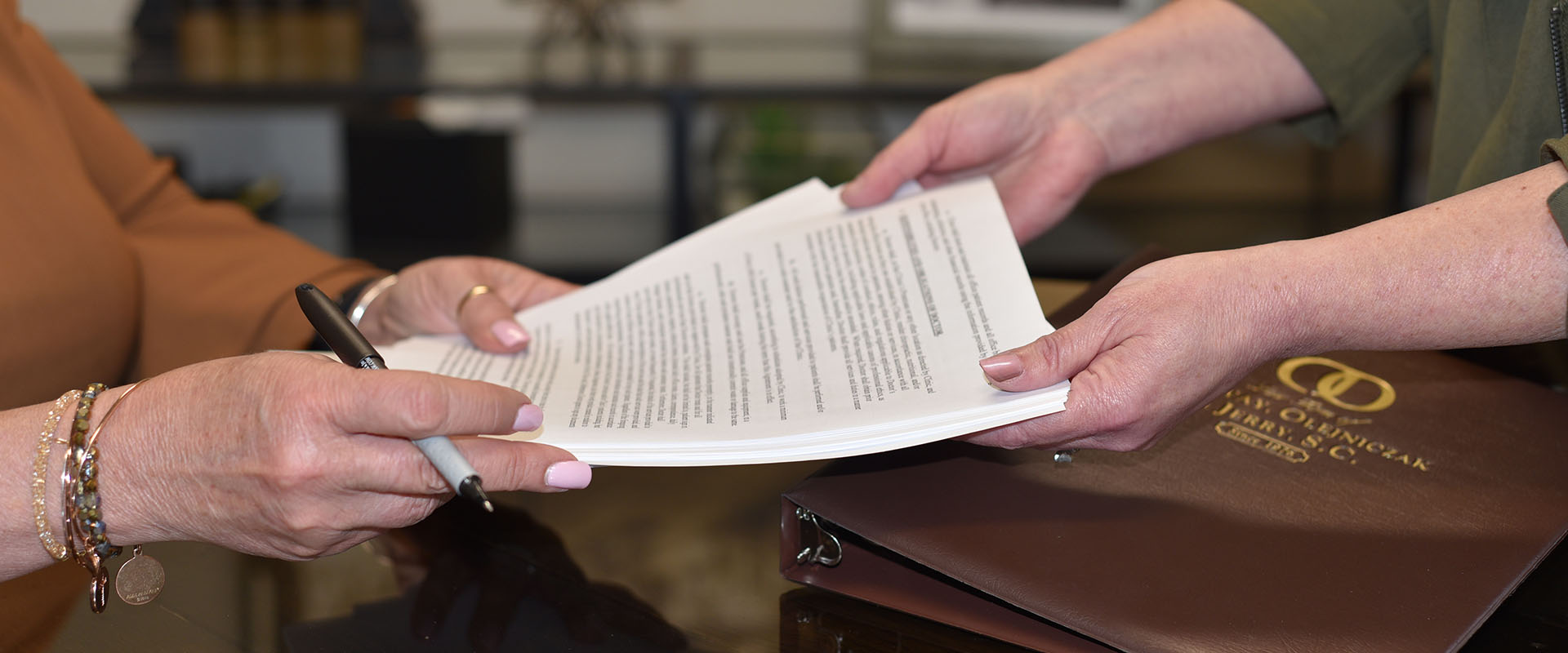 An attorney and client reviewing paperwork