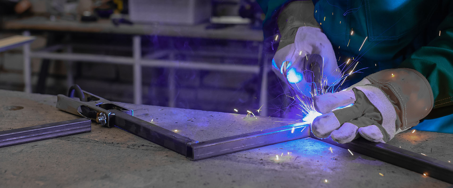 Welding of metal on workbench